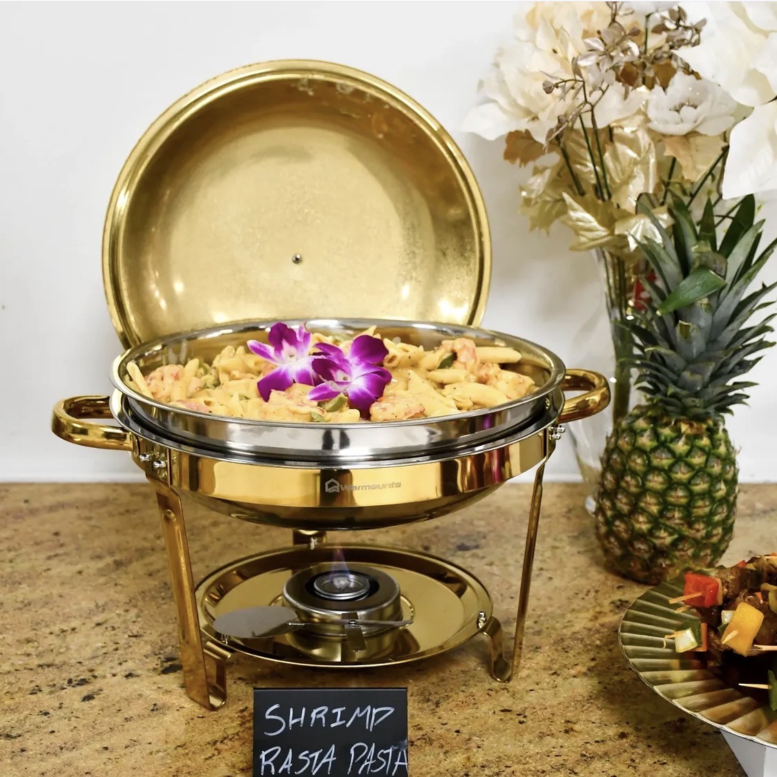 Shrimp rasta pasta in a gold chafing dish
